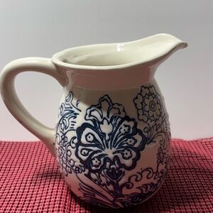 Elegant Blue and White Floral Ceramic Pitcher 
With a raised design